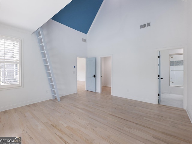 5832 Lula Bridge Ln, Braselton, GA 30517 - unfurnished living room featuring wood finished floors and high vaulted ceiling