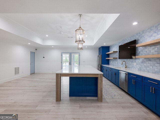 5832 Lula Bridge Ln, Braselton, GA 30517 - kitchen featuring blue cabinets, open shelves, appliances with stainless steel finishes, backsplash, and a raised ceiling