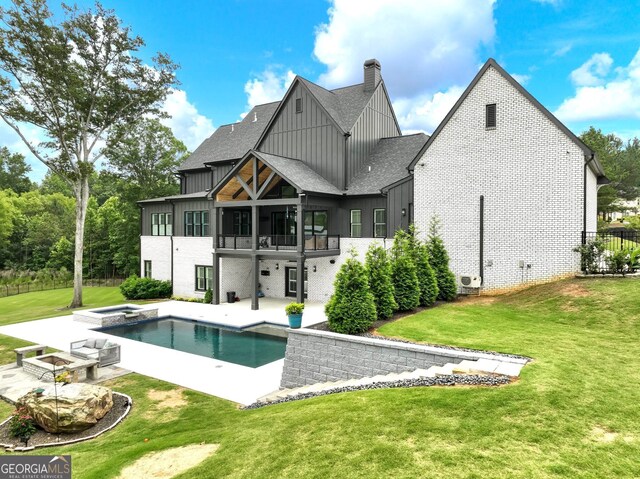 5832 Lula Bridge Ln, Braselton, GA 30517 - rear view of property featuring board and batten siding, a patio, roof with shingles, a yard, and a chimney