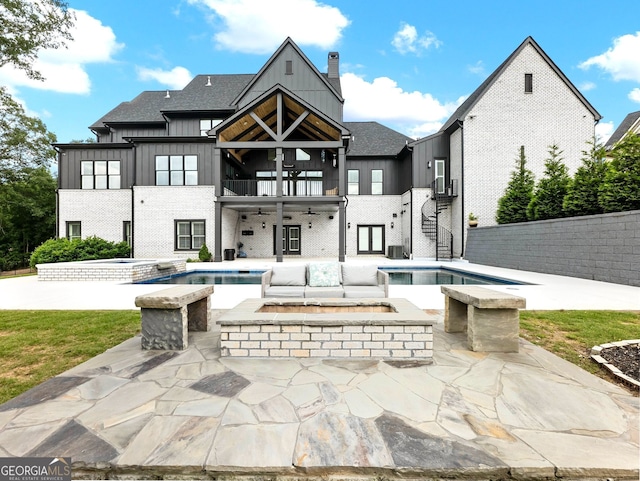 5832 Lula Bridge Ln, Braselton, GA 30517 - rear view of property with an in-ground hot tub, a balcony, stairs, a ceiling fan, and board and batten siding