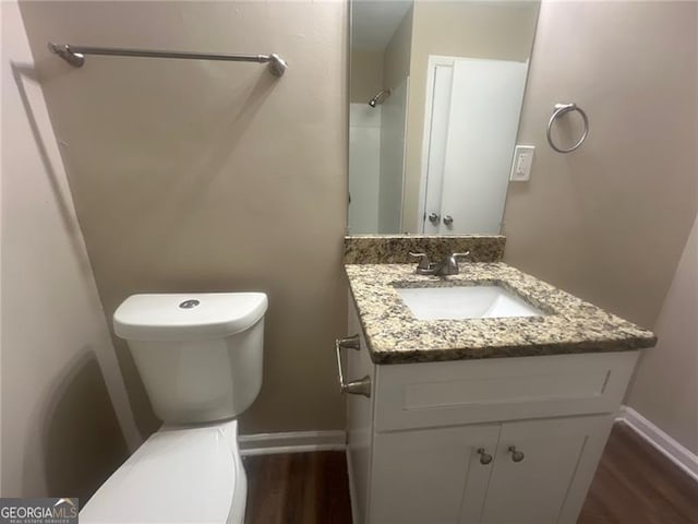 2785 Battle Forrest, Decatur, GA 30034 - bathroom with toilet, vanity, wood finished floors, and baseboards