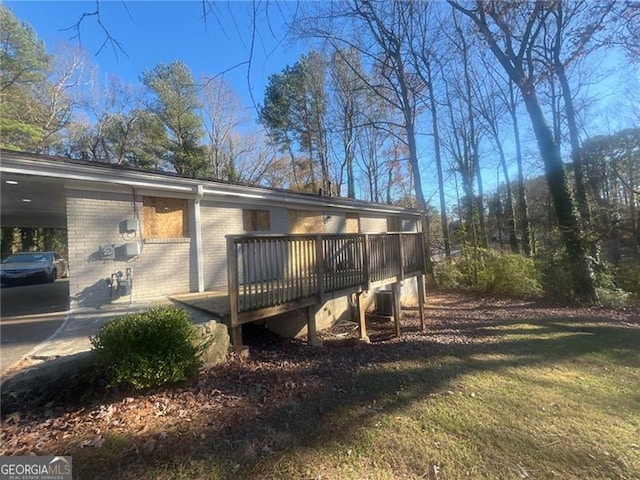 2785 Battle Forrest, Decatur, GA 30034 - back of property with a deck, brick siding, cooling unit, and a carport