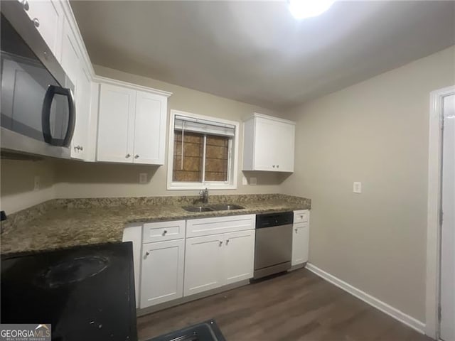 2785 Battle Forrest, Decatur, GA 30034 - kitchen featuring appliances with stainless steel finishes, a sink, dark wood finished floors, baseboards, and white cabinetry