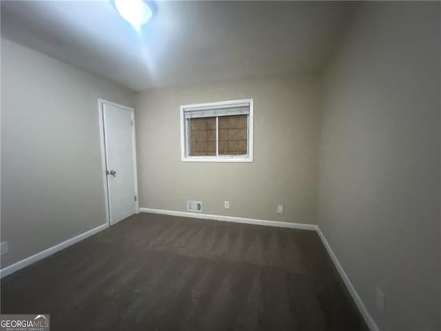 2785 Battle Forrest, Decatur, GA 30034 - empty room with baseboards and dark colored carpet