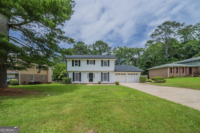 4732 Manly Ct, Stone Mountain, GA 30088 - colonial-style house featuring a garage, driveway, and a front lawn