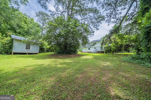 4732 Manly Ct, Stone Mountain, GA 30088 - view of green lawn featuring an outbuilding
