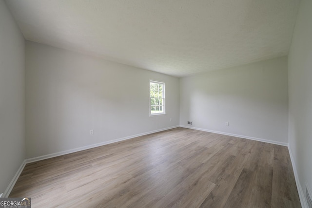 4732 Manly Ct, Stone Mountain, GA 30088 - unfurnished room with wood finished floors and baseboards