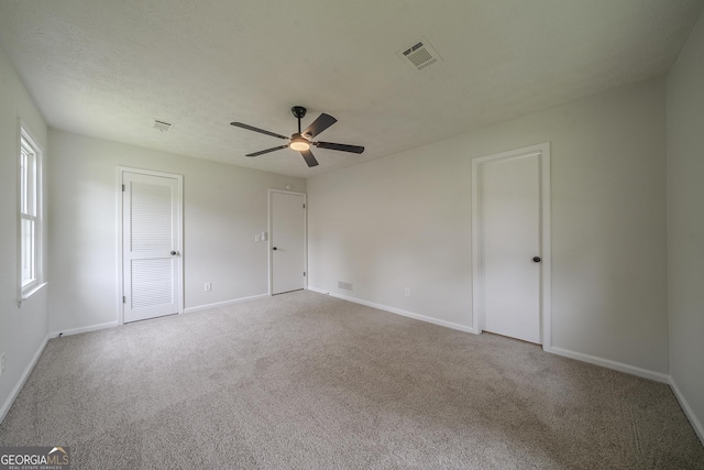 4732 Manly Ct, Stone Mountain, GA 30088 - unfurnished bedroom with carpet flooring, baseboards, and ceiling fan