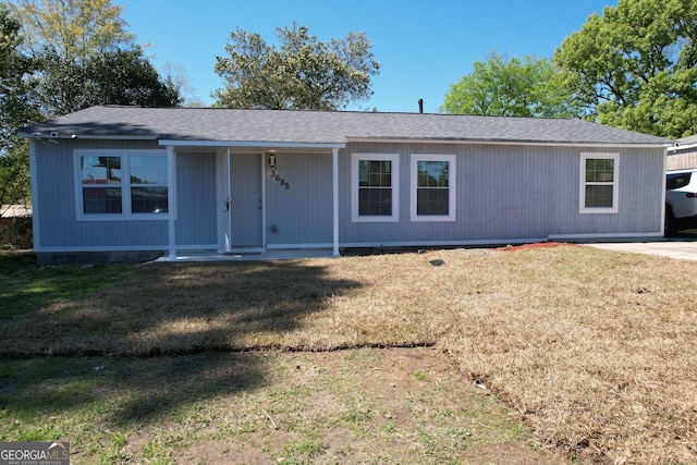 3685 Rice Mill Rd, Macon, GA 31206 - view of front of property with a front yard, covered porch, and roof with shingles