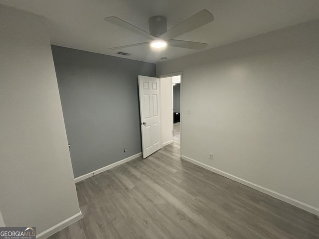 3685 Rice Mill Rd, Macon, GA 31206 - unfurnished room featuring ceiling fan, wood finished floors, and baseboards