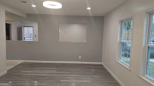 3685 Rice Mill Rd, Macon, GA 31206 - unfurnished room featuring healthy amount of natural light, baseboards, wood finished floors, and recessed lighting