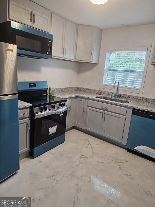 3685 Rice Mill Rd, Macon, GA 31206 - kitchen with stainless steel appliances, a sink, gray cabinets, and light marble finish flooring