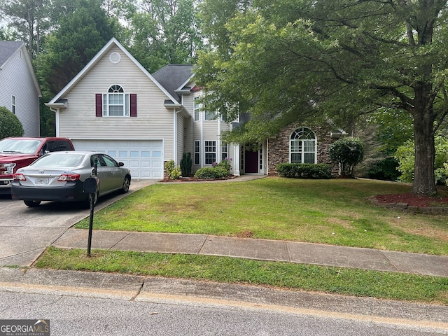 5327 Yoshino Ter, Powder Springs, GA 30127 - view of front of house with an attached garage, driveway, and a front lawn