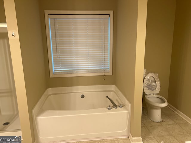 5327 Yoshino Ter, Powder Springs, GA 30127 - bathroom with a garden tub and tile patterned flooring