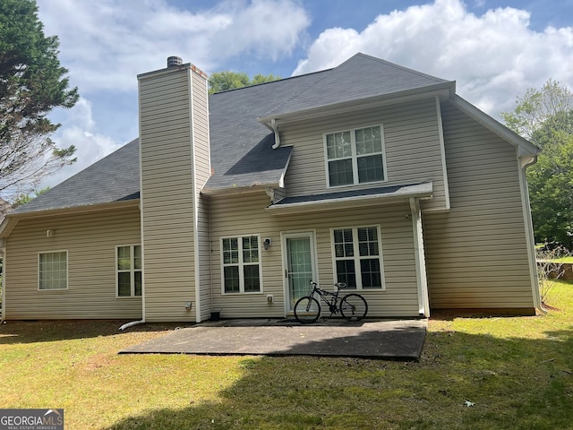 5327 Yoshino Ter, Powder Springs, GA 30127 - back of property featuring a patio area, a lawn, and a chimney