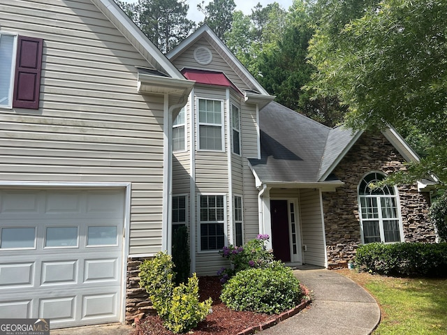 5327 Yoshino Ter, Powder Springs, GA 30127 - view of front of property with stone siding and an attached garage