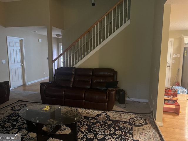 5327 Yoshino Ter, Powder Springs, GA 30127 - living area featuring stairway and wood finished floors