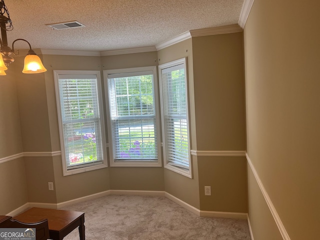 5327 Yoshino Ter, Powder Springs, GA 30127 - carpeted empty room featuring plenty of natural light, a textured ceiling, a chandelier, and crown molding