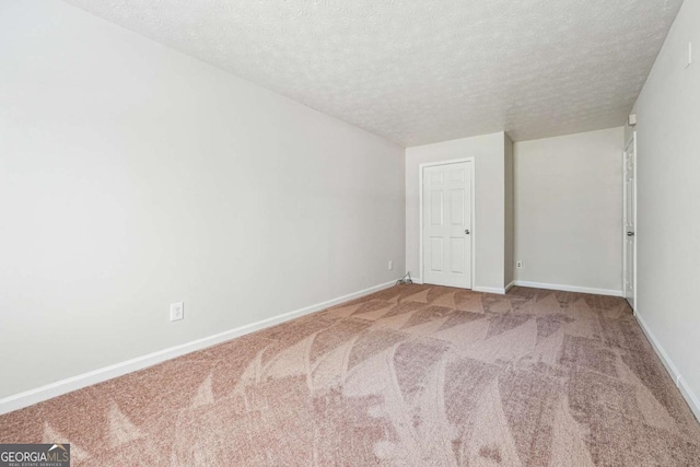 4448 Janice Dr, Snellville, GA 30039 - carpeted empty room featuring a textured ceiling and baseboards