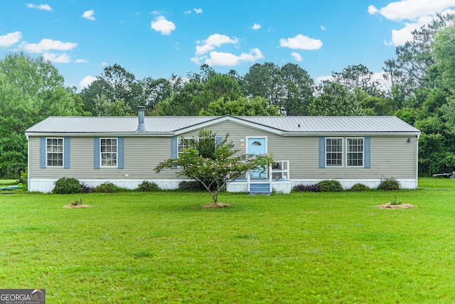 6162 Ayrin Brooke Ln, Blackshear, GA 31516 - manufactured / mobile home featuring a front lawn, metal roof, and view of wooded area
