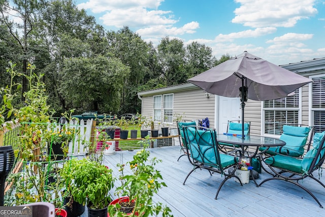 6162 Ayrin Brooke Ln, Blackshear, GA 31516 - wooden terrace featuring outdoor dining area