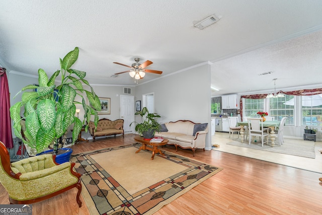 6162 Ayrin Brooke Ln, Blackshear, GA 31516 - living area with a textured ceiling, wood finished floors, ceiling fan, and crown molding