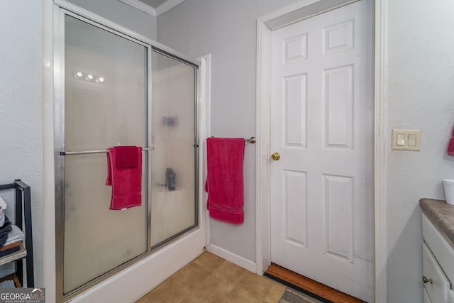6162 Ayrin Brooke Ln, Blackshear, GA 31516 - bathroom featuring a shower stall, vanity, and crown molding