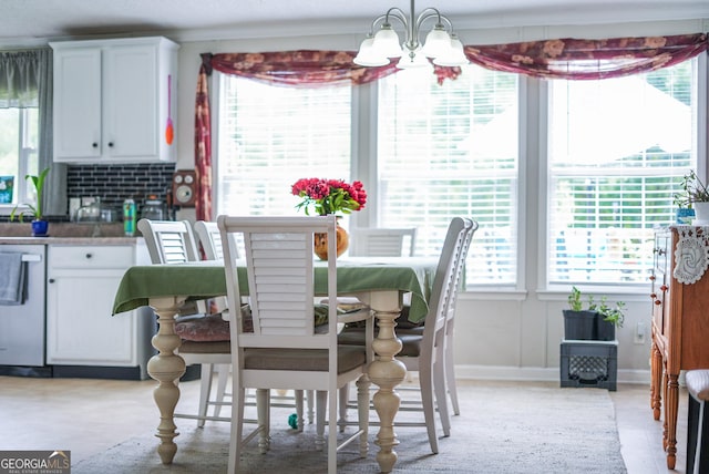 6162 Ayrin Brooke Ln, Blackshear, GA 31516 - dining area with a chandelier and baseboards