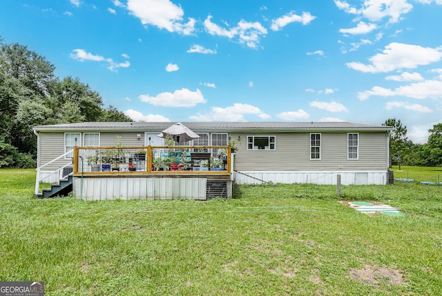 6162 Ayrin Brooke Ln, Blackshear, GA 31516 - rear view of property featuring a deck and a yard