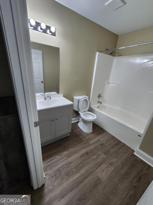 116 Ronald Pride Blvd, Fort Valley, GA 31030 - full bath featuring toilet, wood finished floors, vanity, and shower / washtub combination
