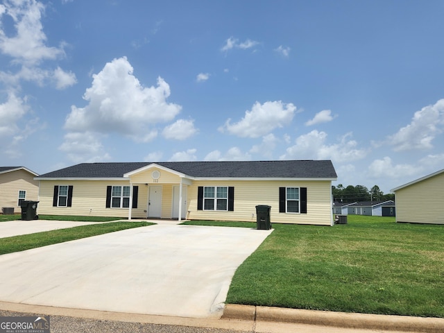 116 Ronald Pride Blvd, Fort Valley, GA 31030 - ranch-style home with concrete driveway, a front lawn, and central air condition unit