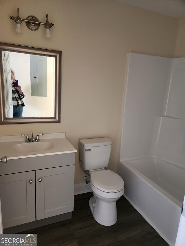 116 Ronald Pride Blvd, Fort Valley, GA 31030 - bathroom featuring electric panel, wood finished floors, vanity, and  shower combination