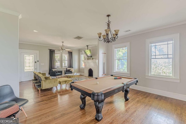 975 Dill Ave SW, Atlanta, GA 30310 - game room with healthy amount of natural light, wood finished floors, pool table, a chandelier, and ornamental molding