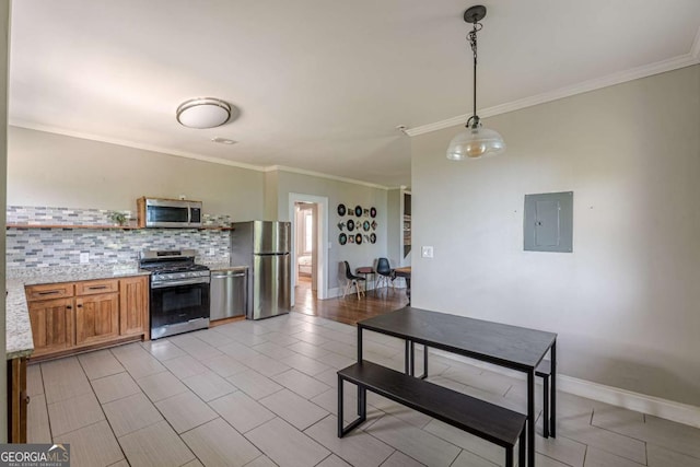 975 Dill Ave SW, Atlanta, GA 30310 - kitchen with stainless steel appliances, electric panel, crown molding, tasteful backsplash, and brown cabinets