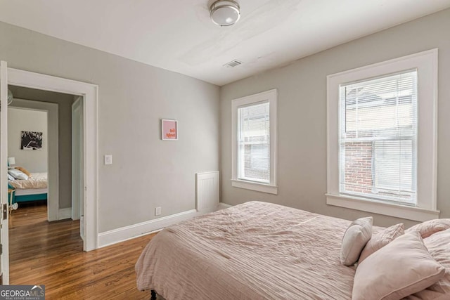 975 Dill Ave SW, Atlanta, GA 30310 - bedroom featuring wood finished floors and baseboards