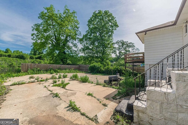 975 Dill Ave SW, Atlanta, GA 30310 - fenced backyard featuring a patio and stairway