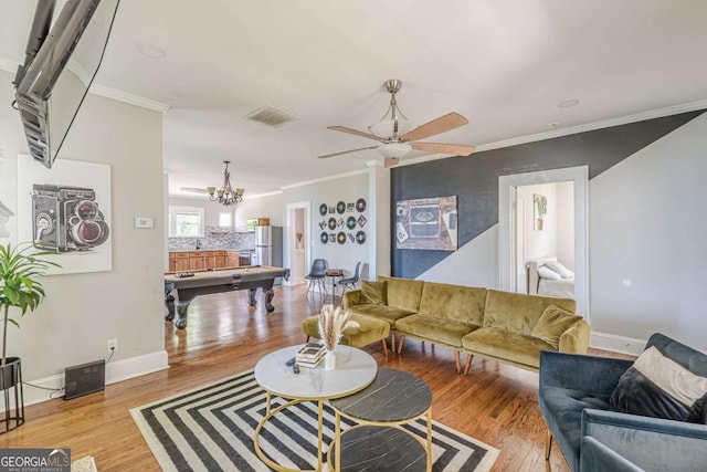 975 Dill Ave SW, Atlanta, GA 30310 - living room with pool table, ornamental molding, wood finished floors, and a ceiling fan