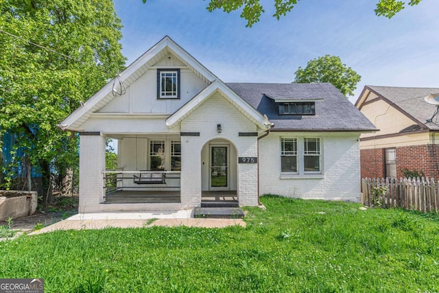 975 Dill Ave SW, Atlanta, GA 30310 - view of front of property with brick siding and a porch