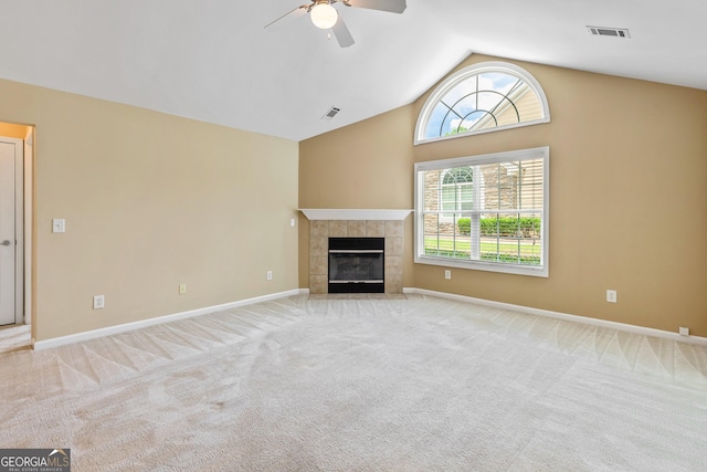 140 Rehobeth Way, Fayetteville, GA 30214 - unfurnished living room with ceiling fan, carpet flooring, a tiled fireplace, and high vaulted ceiling