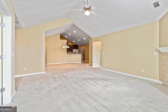 140 Rehobeth Way, Fayetteville, GA 30214 - unfurnished living room featuring vaulted ceiling, ceiling fan, light colored carpet, recessed lighting, and a chandelier
