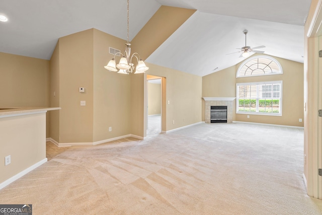 140 Rehobeth Way, Fayetteville, GA 30214 - unfurnished living room with lofted ceiling, ceiling fan, light colored carpet, a chandelier, and a tile fireplace