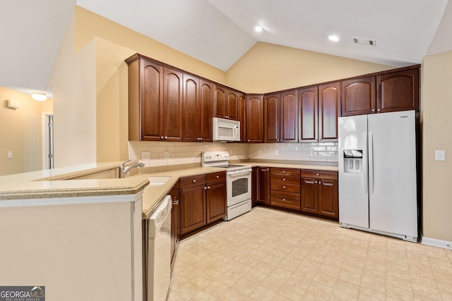 140 Rehobeth Way, Fayetteville, GA 30214 - kitchen featuring white appliances, lofted ceiling, a peninsula, light floors, and light countertops