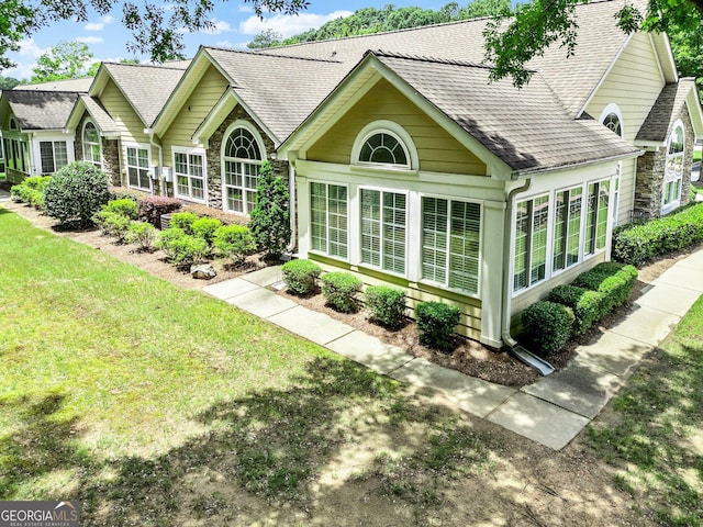 140 Rehobeth Way, Fayetteville, GA 30214 - rear view of house with stone siding, roof with shingles, and a lawn