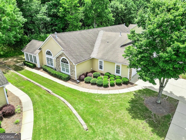 140 Rehobeth Way, Fayetteville, GA 30214 - view of front of home with stone siding, a front lawn, and roof with shingles
