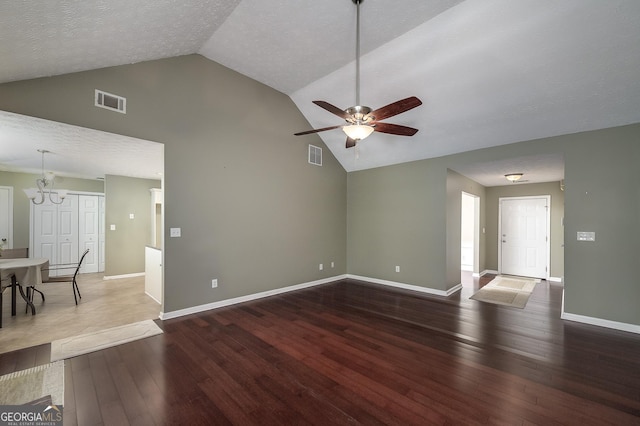 35 Deep Springs Way, Covington, GA 30016 - unfurnished living room with a chandelier, a ceiling fan, high vaulted ceiling, hardwood / wood-style flooring, and baseboards