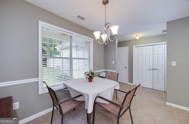 35 Deep Springs Way, Covington, GA 30016 - dining space with plenty of natural light, a chandelier, baseboards, and light tile patterned floors