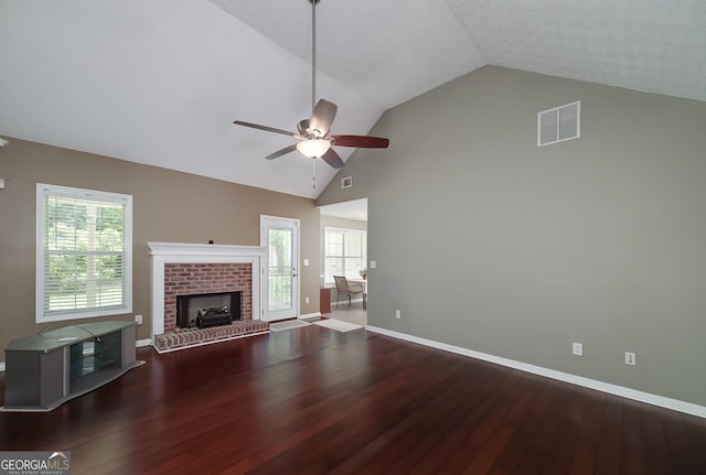 35 Deep Springs Way, Covington, GA 30016 - unfurnished living room featuring ceiling fan, wood finished floors, baseboards, a fireplace, and healthy amount of natural light