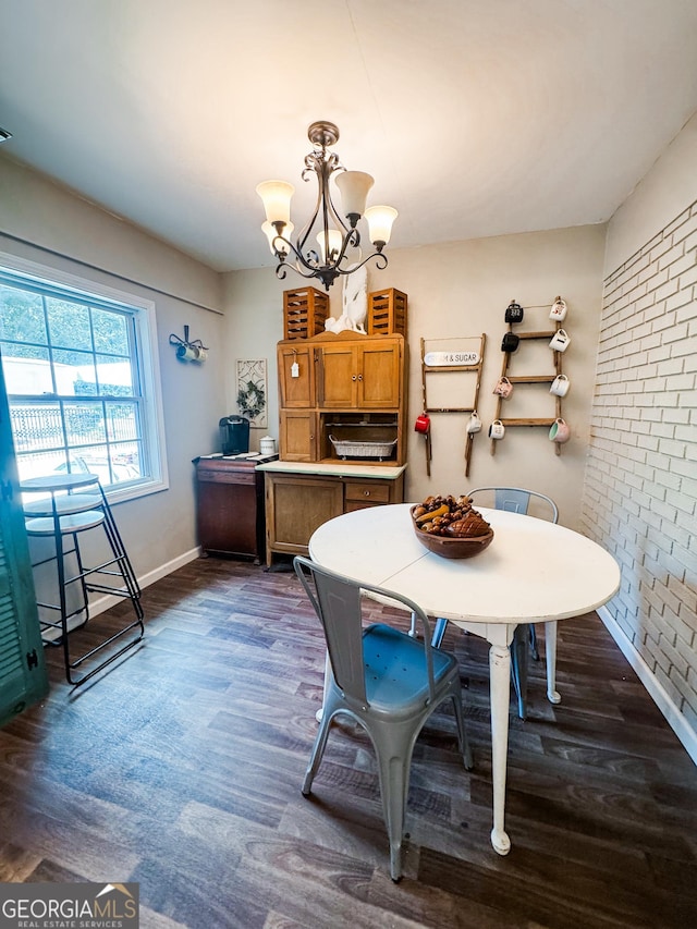 225 Second St, Bowdon, GA 30108 - dining space featuring a chandelier, dark wood-type flooring, and baseboards