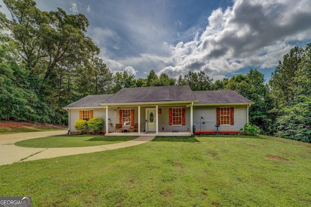 527 Malcom Rd, Covington, GA 30014 - ranch-style home featuring a front yard, a porch, and driveway