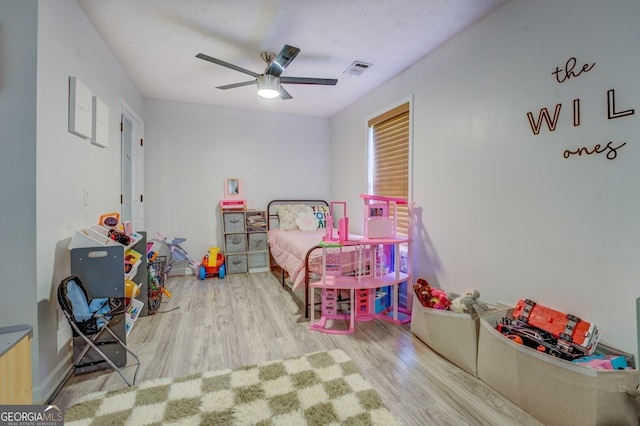 527 Malcom Rd, Covington, GA 30014 - bedroom with wood finished floors and ceiling fan